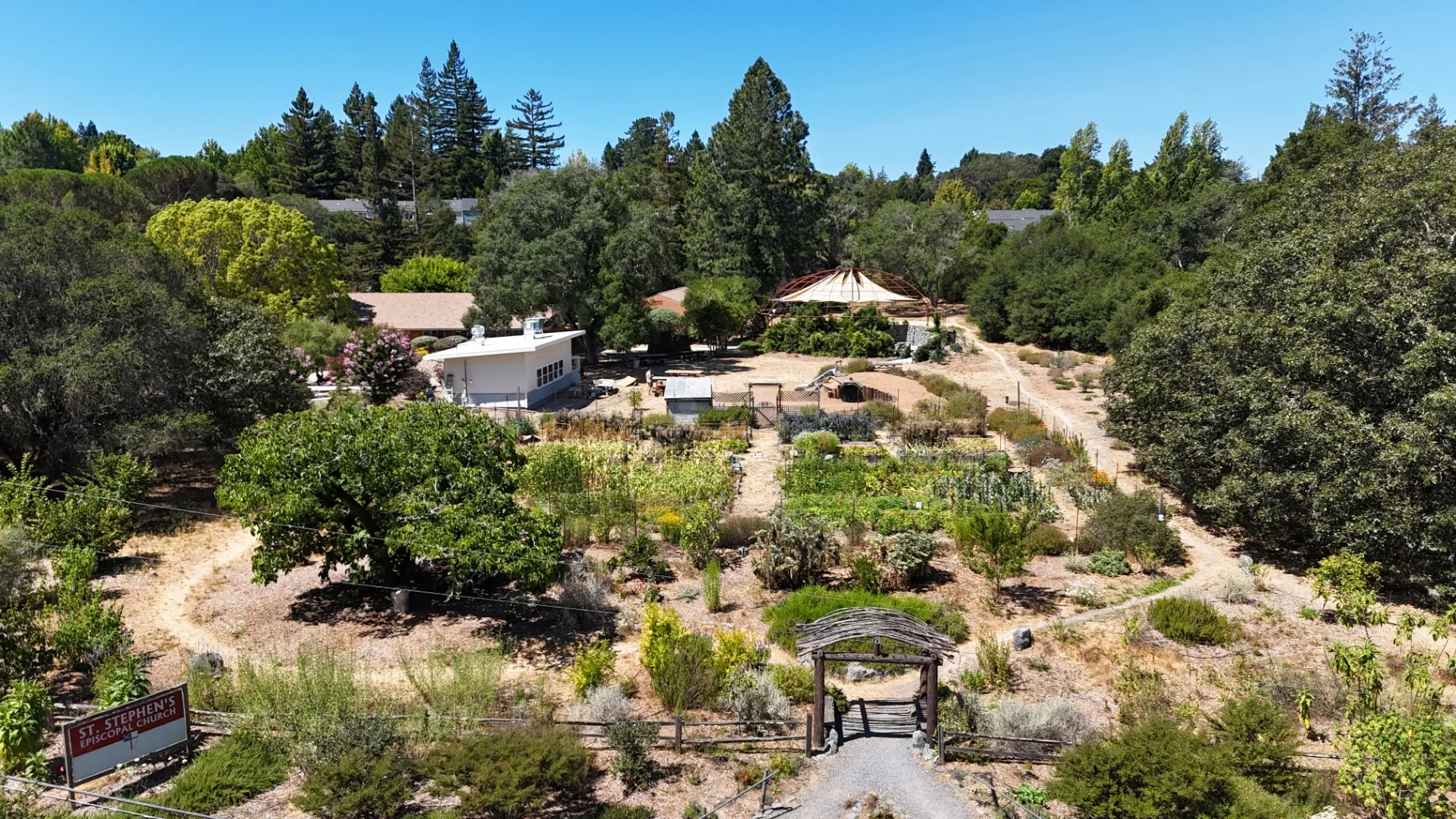 Aerial view of landscaped garden with pathways and greenery